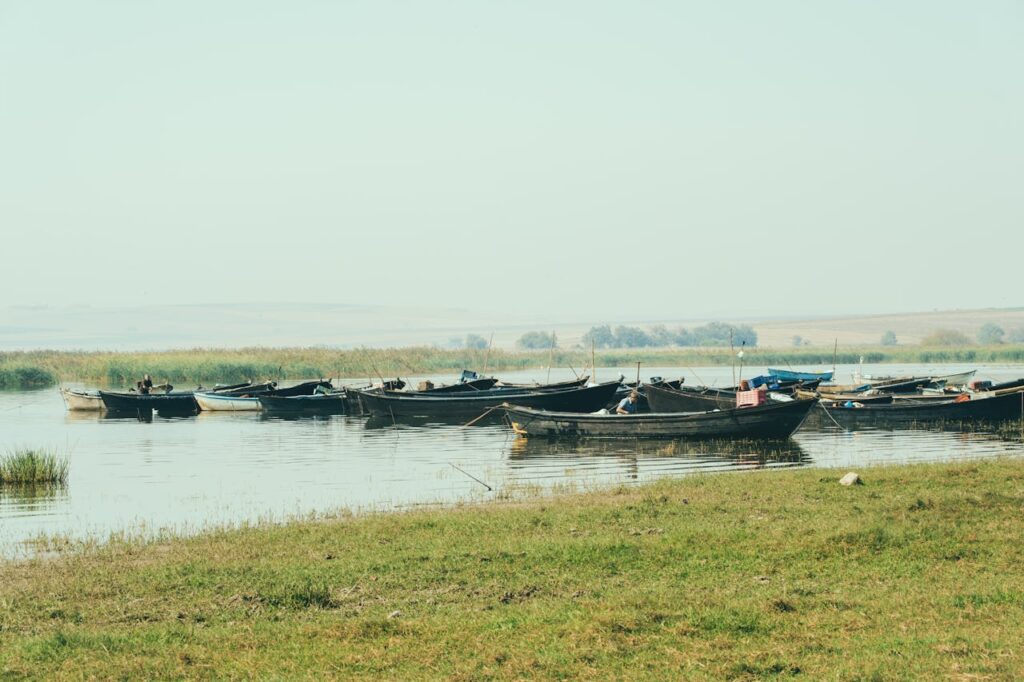 Peaceful Lake Scene with Fishing Boats Afloat